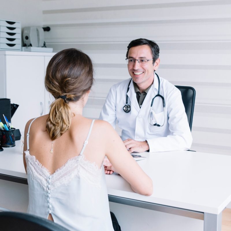 Male doctor with female patient